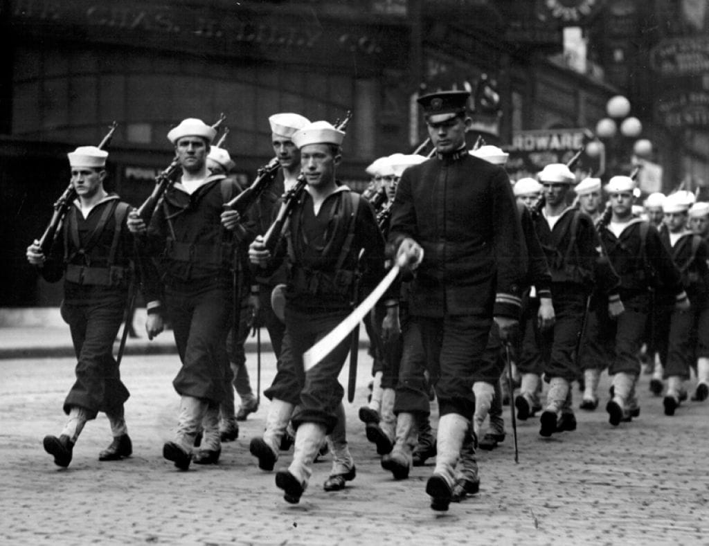 Naval cadets marching down Seattle street