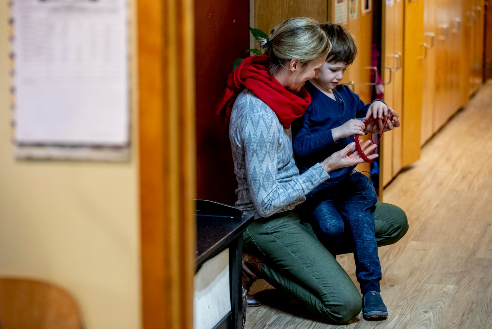 Jill and Hugo in the hallway at his school