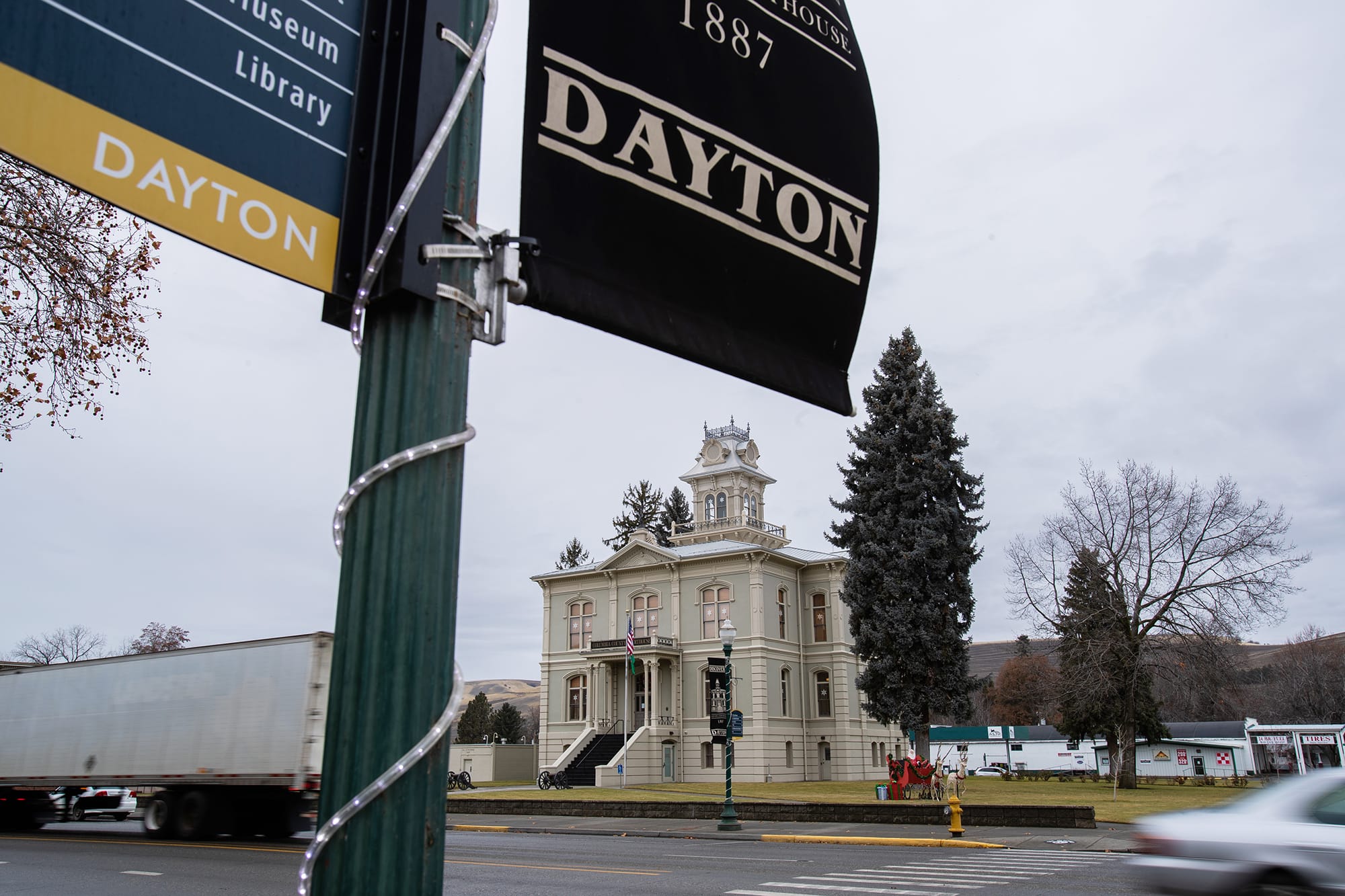 A Dayton city flag flies in front of the Columbia County courthouse