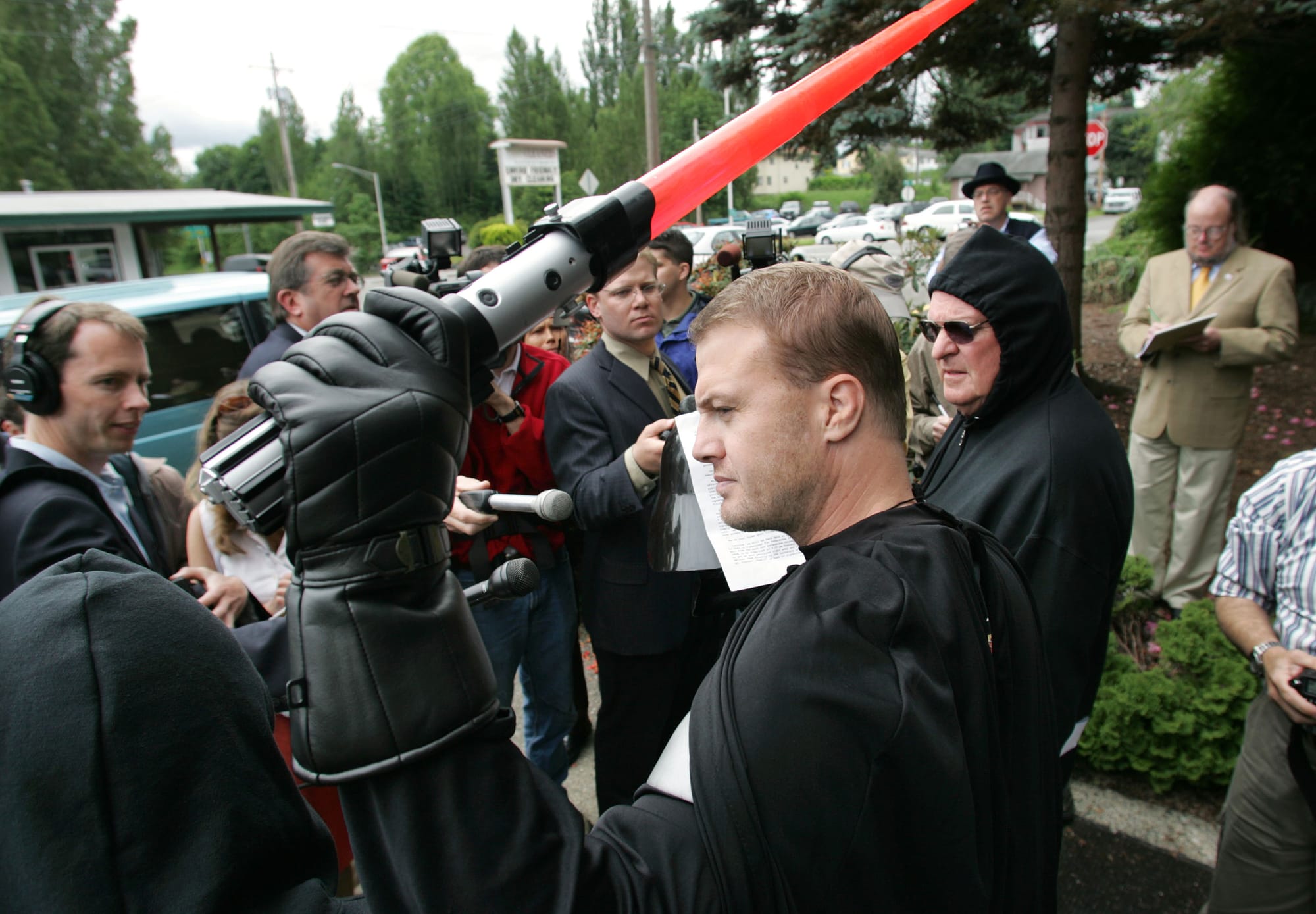 Tim Eyman, dressed as Darth Vader, holding a plastic light saber