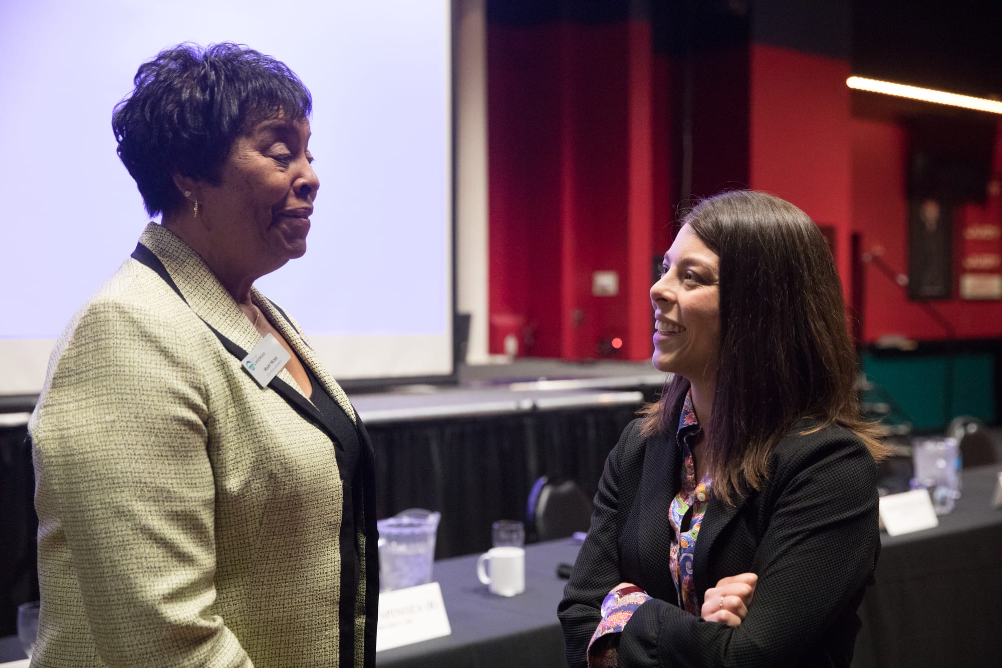 Washington state house of representatives candidate Maia Espinoza with business owner after a Lakewood Chamber of Commerce candidate forum at Great American Casino in Lakewood, Oct. 4, 2018. (Photo by Matt M. McKnight/Crosscut)