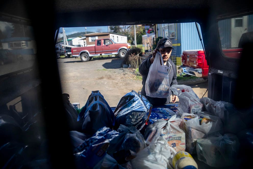 Marcelino unlopads the truck bed