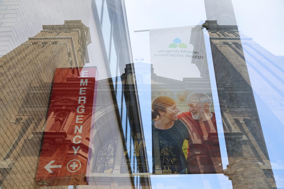 Multiple exposure photo of an emergency room sign, an archway of a church, and a banner ad for Virginia Mason Franciscan Health showing a man and a woman each with an arm around the other