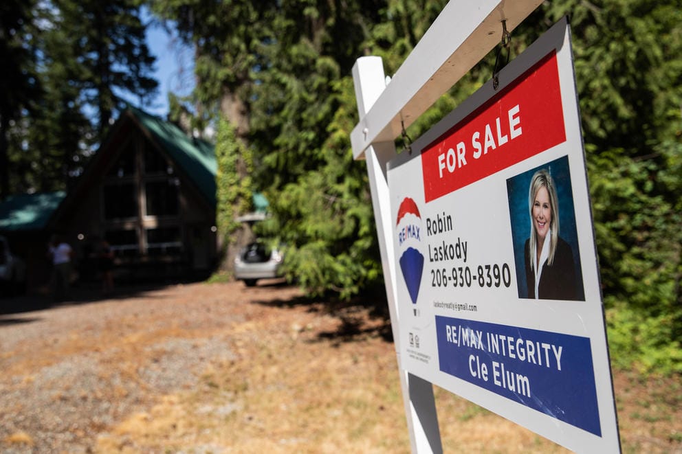 A sign showing a home for sale in Ronald