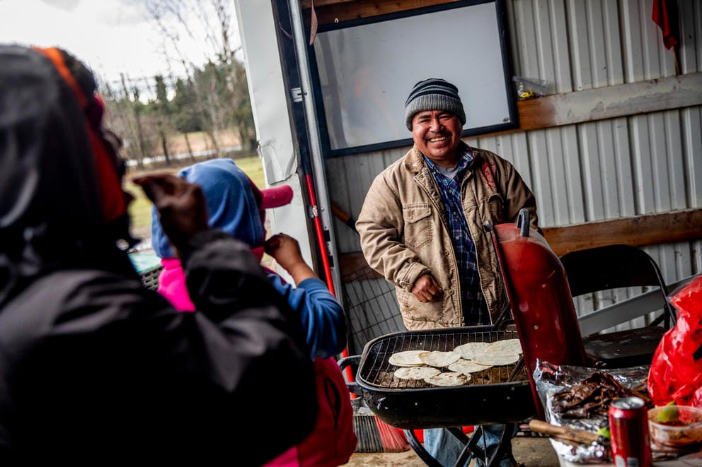 Ramon laughs at the grill