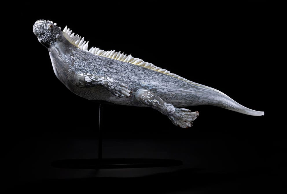 photo of a glass sculpture of a marine iguana