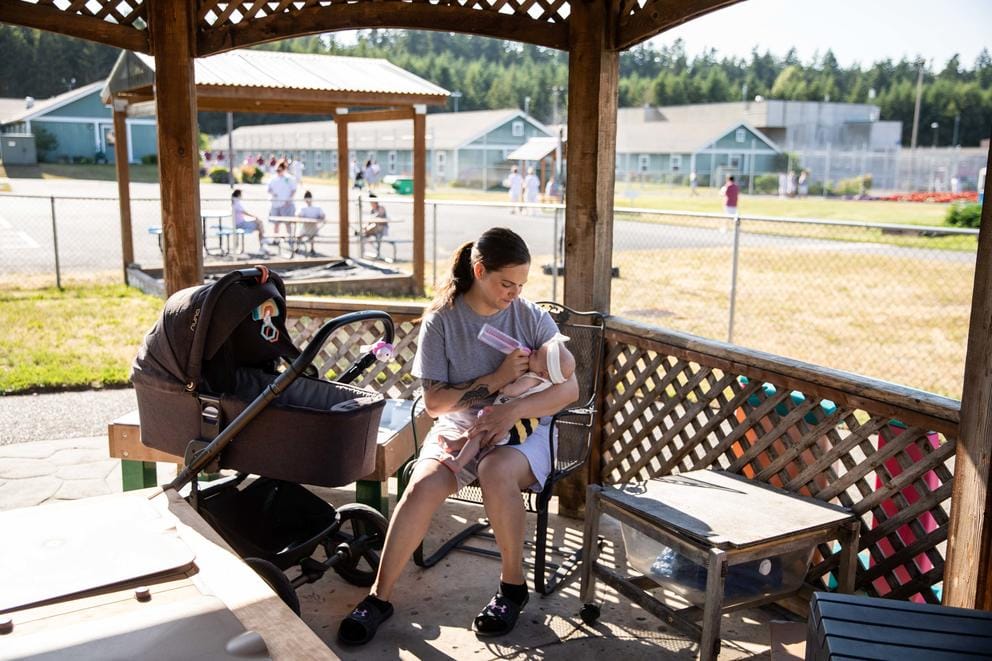 Marie Haller feeds her newborn Dahlia outside at the Washington Corrections Center for Women