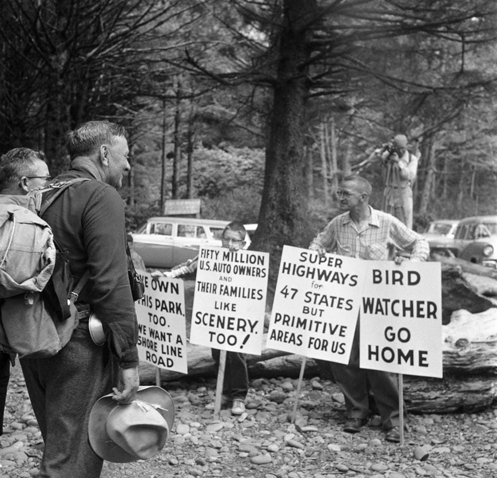 Justice William O. Douglas is confronted by a protester.