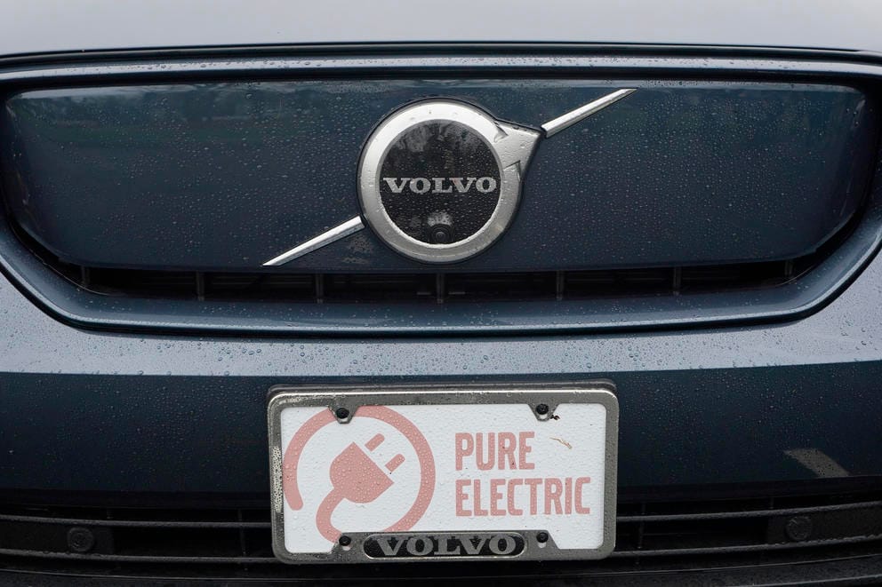 A Volvo XC40 electric vehicle is shown at a news conference in Olympia